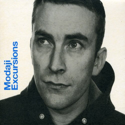 Black and white portrait of Modaji, album title vertically on the left.