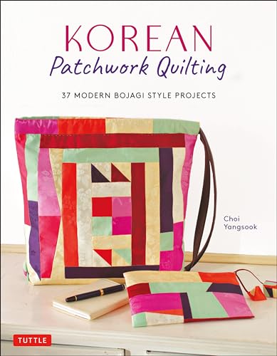 Colorful patchwork bag and pouch on a table with a notebook and pen.