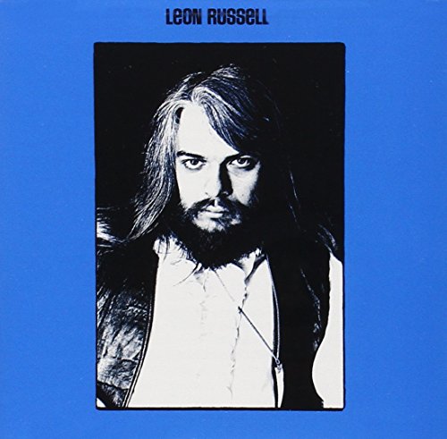 Leon Russell album cover: black and white portrait on blue background.