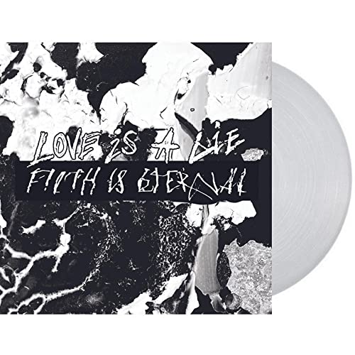 Vinyl record with black and white marbled cover, text reads "Love Is A Lie".