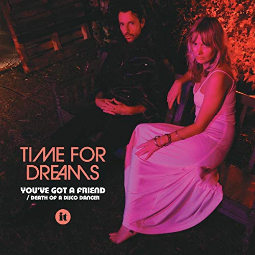 Album cover featuring a man and woman seated outdoors, pink lighting.