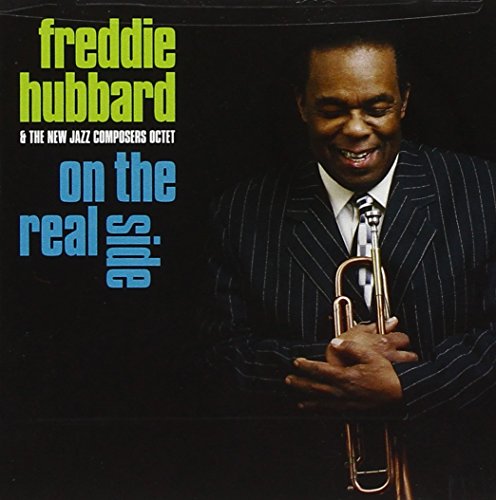 CD cover of Freddie Hubbard holding a trumpet, wearing a pinstripe suitBL suit.