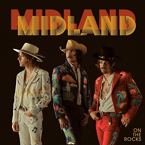 Midland band album cover featuring three men in cowboy hats and suits.