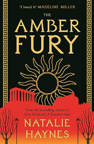 Book cover with amber colored background and title, author name, and review quote in text.