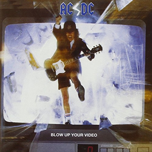 AC/DC album cover: musician playing guitar bursting from a shattered TV.