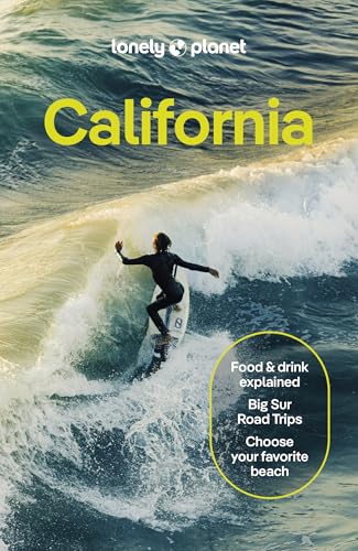 A surfer rides a wave on the cover of a Lonely Planet California travel guide.