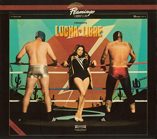 CD cover: two masked wrestlers and a woman in a wrestling ring.