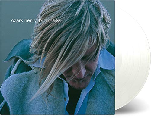Vinyl record and album cover featuring a man with long hair.