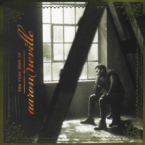 CD cover: Aaron Neville sits pensively in front of a window.