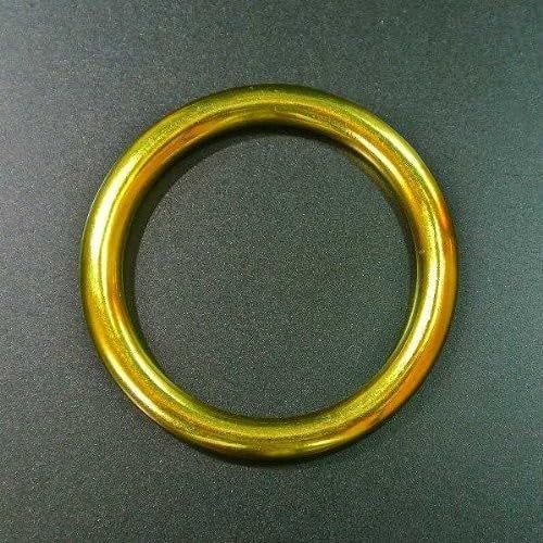 Golden ring against a dark background, likely CD packaging detail.