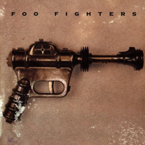 Foo Fighters album cover featuring a vintage ray gun on a brown background.
