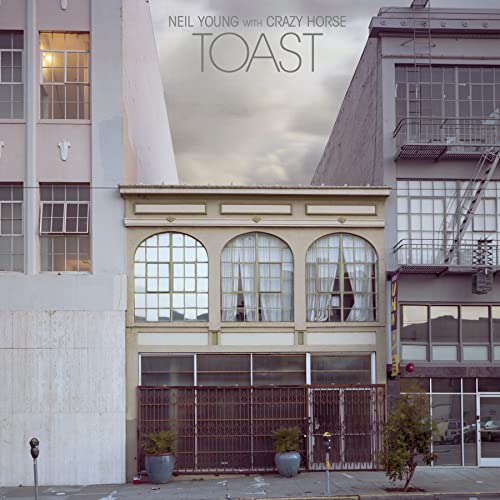 Album cover for Neil Young & Crazy Horse’s “Toast” featuring a building facade.