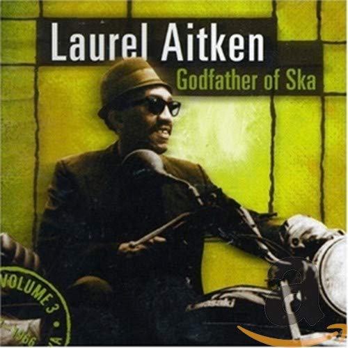 Laurel Aitken CD cover featuring a man with a motorcycle, yellow background.