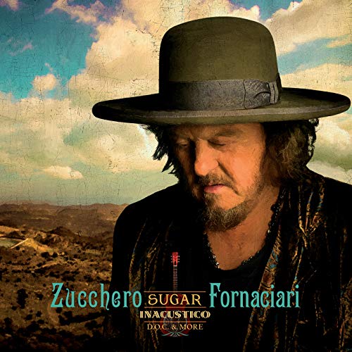 Zucchero in a hat, album cover with desert landscape background.