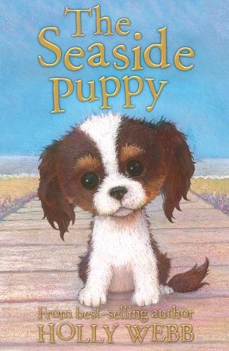 A children's book cover featuring an illustration of a puppy by the seaside.