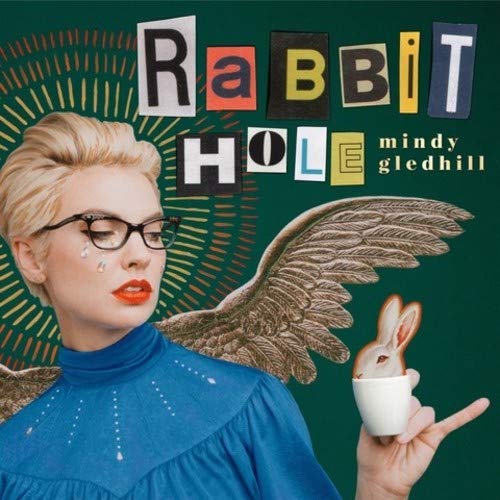 Album cover for Mindy Gledhill’s “Rabbit Hole” featuring a woman and rabbit.