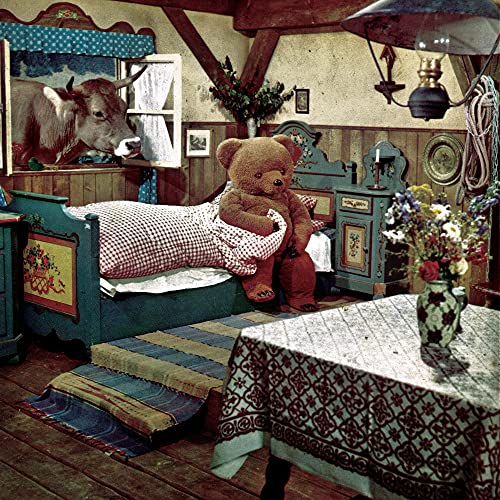 Album cover: rustic room with a teddy bear, cow portrait, and bed.