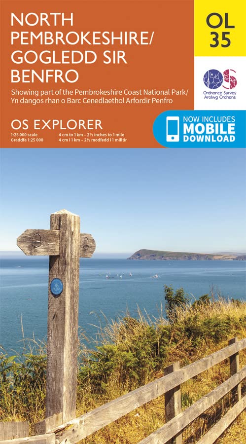 A wooden signpost on a cliffside overlooking a body of water and distant landmass.