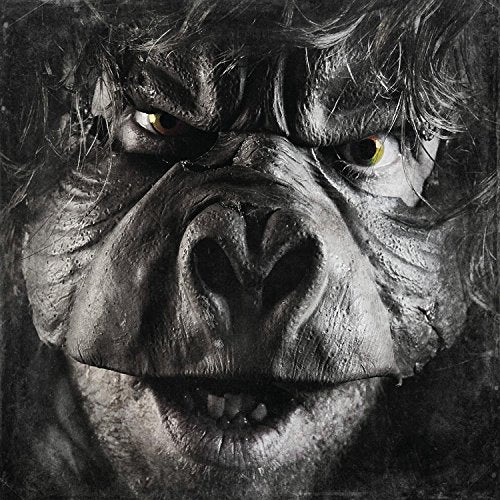CloseLooming closeClose-up of a gorilla's face with an intense expression and glowing eyes.
