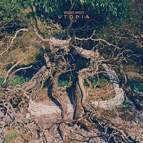 CD cover for "Utopia" by Bremer/McCoy, featuring tree roots and stones.