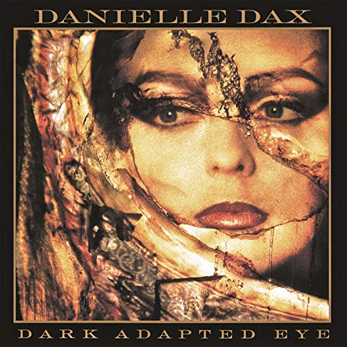 CD cover: woman’s face with gold leaf and dark textures.