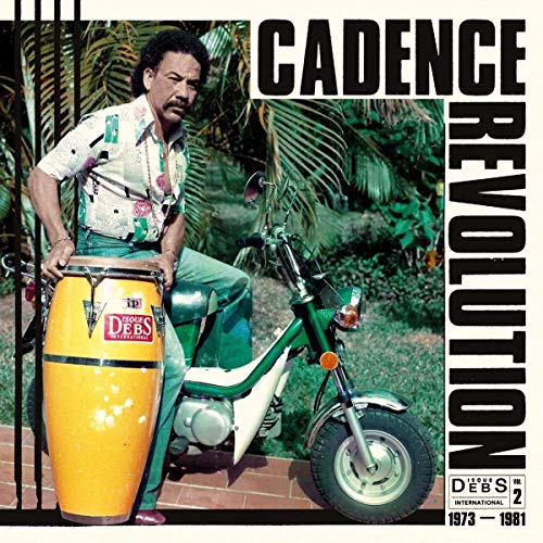 CD cover: man with congas and a small motorcycle, tropical foliage.