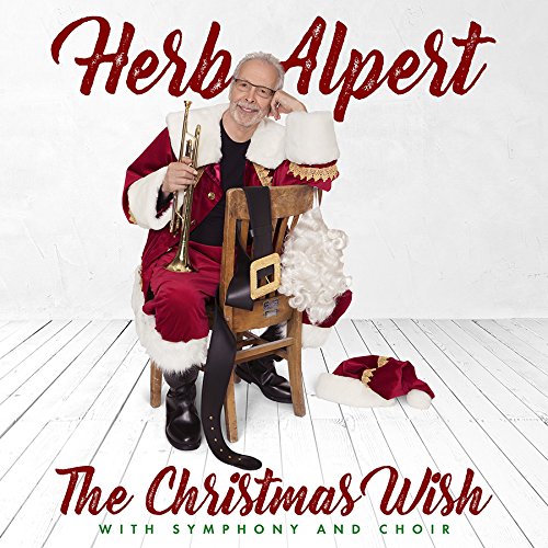 Herb Alpert in a Santa suit playing a trumpet, album cover.