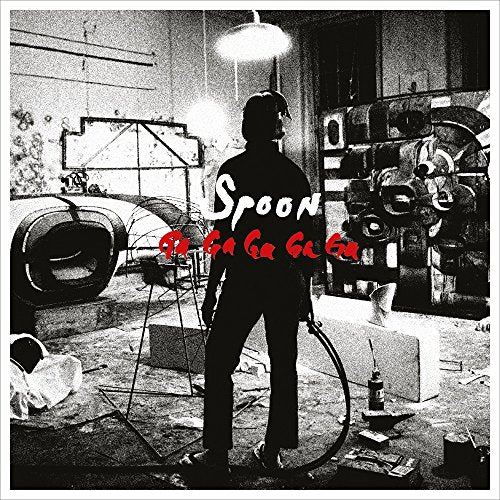 Black and white album cover featuring a silhouetted figure in a cluttered room.