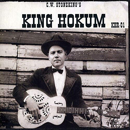 Black and white album cover featuring a man with a guitar.
