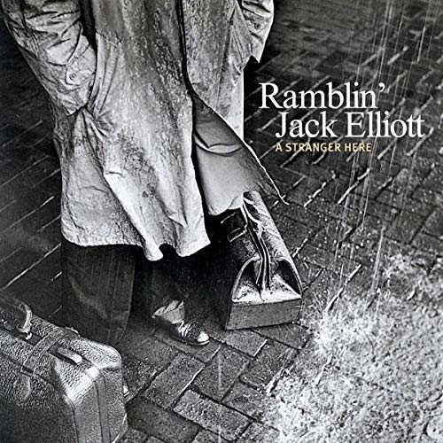 Black and white album cover featuring a man in a coat and suitcase.