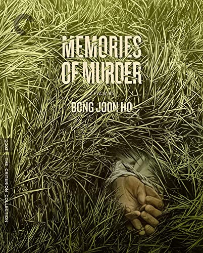 Blu-ray cover for “Memories of Murder” shows tall grass and a hidden hand.