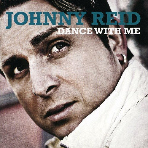 Johnny Reid album cover, close-up portrait of a man looking upwards.