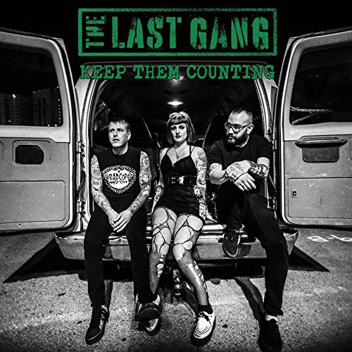 CD cover: three people sit in the back of a van.