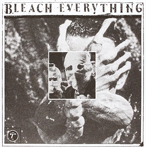 Black and white album cover with distorted figures and a central framed face.