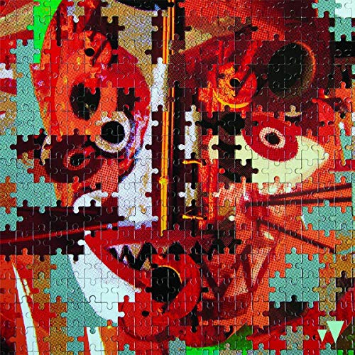 CD cover art depicting a portrait fragmented like a jigsaw puzzle.