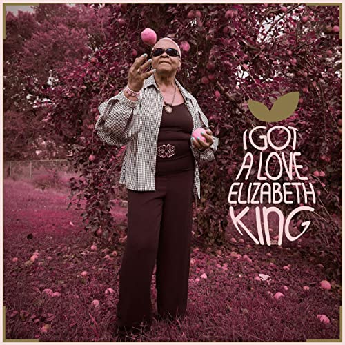 Elizabeth King album cover: woman with apples in an orchard.