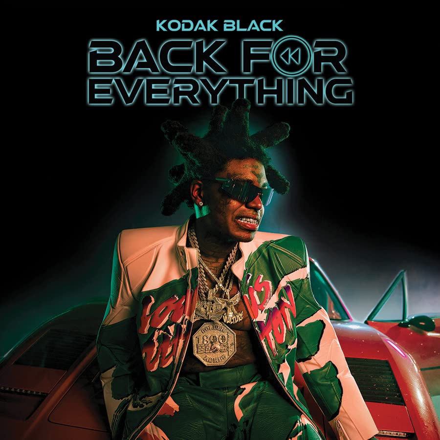 Kodak Black album cover featuring the artist with jewelry and a car.