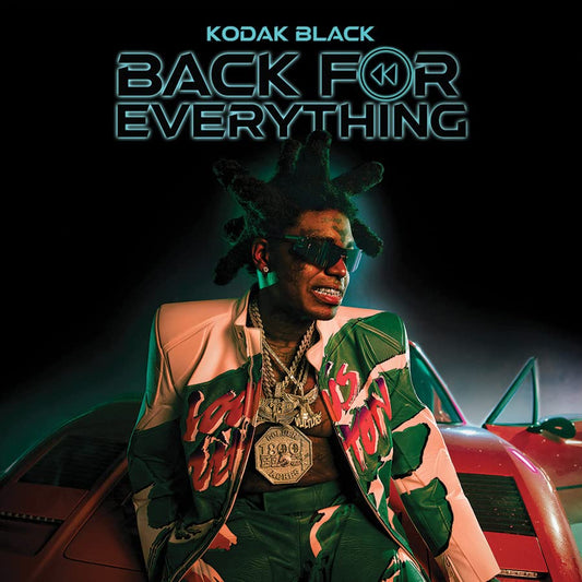 Kodak Black album cover featuring the artist with jewelry and a car.