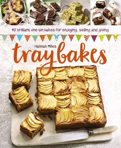Colorful baked goods arranged on a tray with a rustic background and recipe book cover.