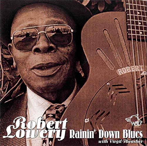 Robert Lowery album cover, sepia tone, man with guitar and sunglasses.