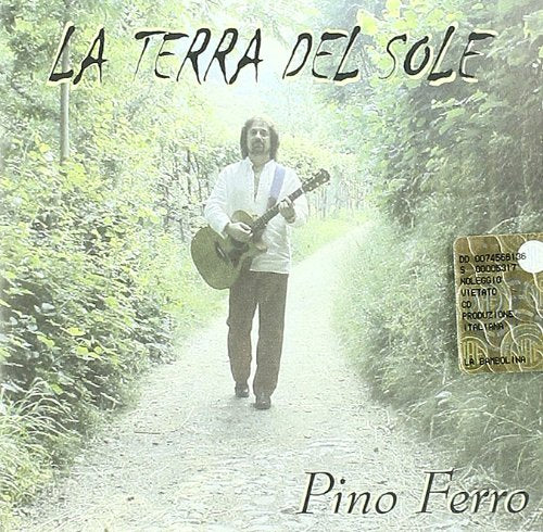 CD cover: man with guitar walking down a country road.