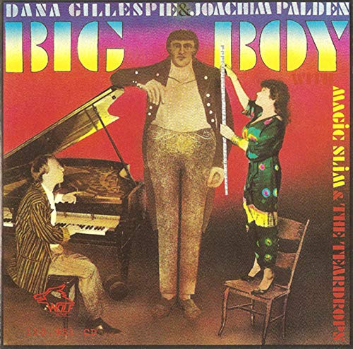 CD cover: musicians with a piano, and a man appearing giant-sized.