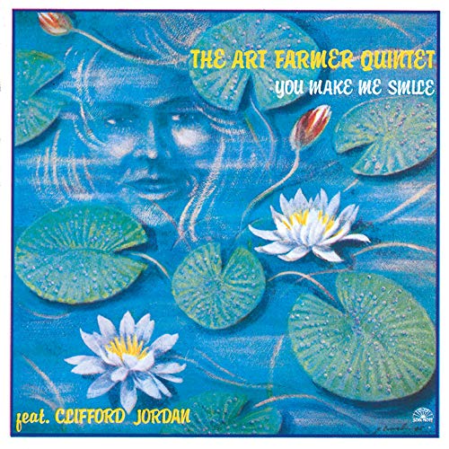 CD cover: abstract blue water lilies and a faded face.
