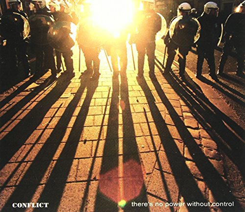 Riot police forming a line, backlit by a bright, hazy light source.