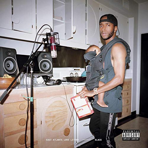 6LACK holding a baby in a kitchen recording studio, album cover.
