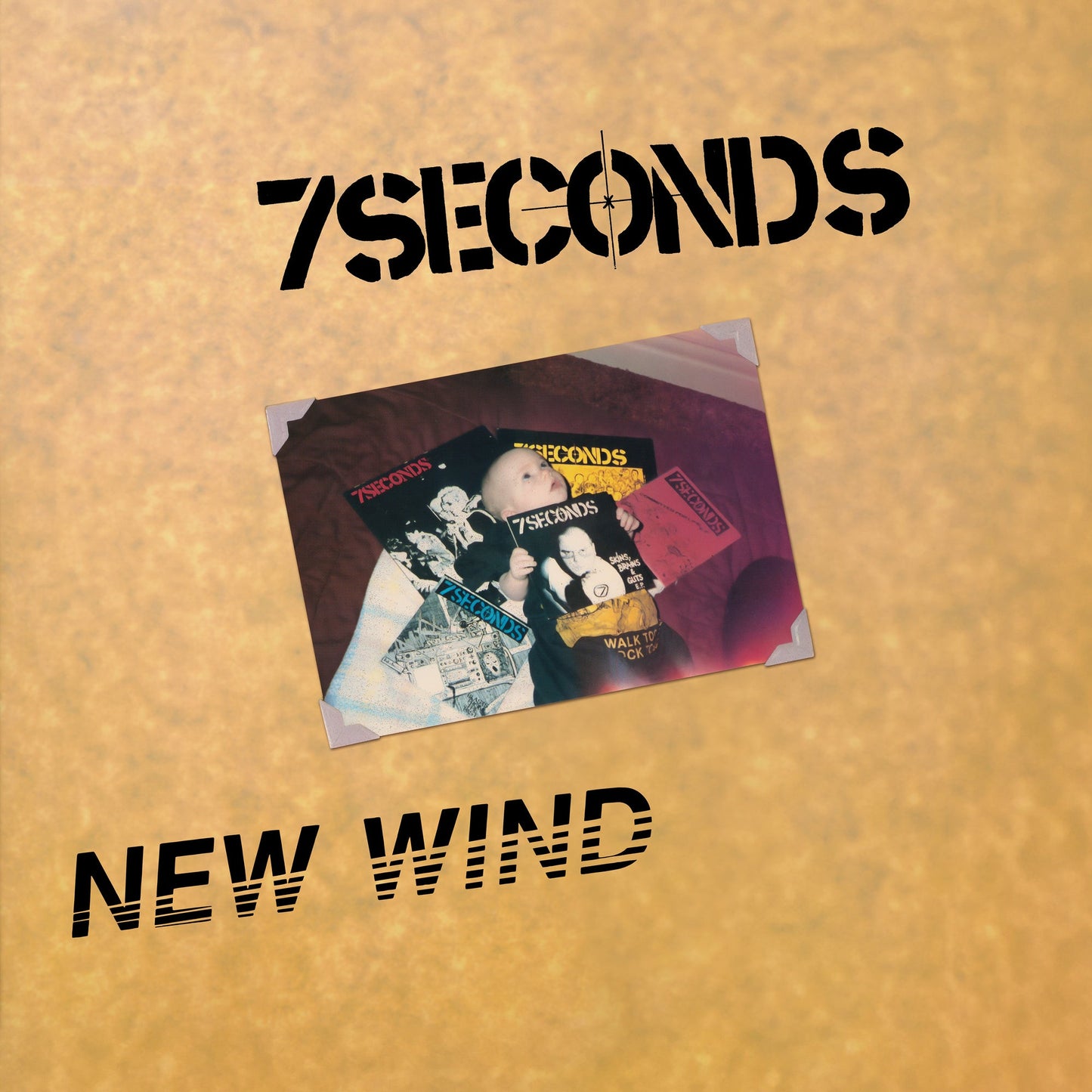A beige background with 7Seconds text and a photo of a baby holding records.
