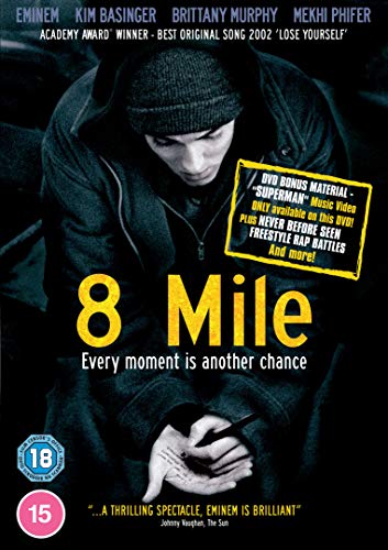 "8 Mile DVD cover featuring Eminem in a beanie, holding a microphone, with dark background."