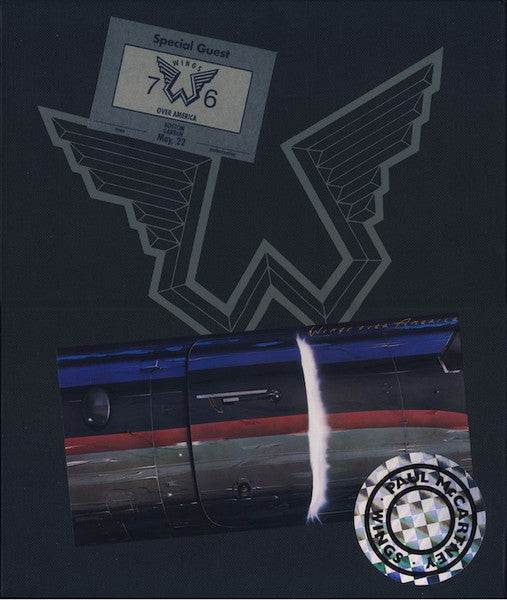 DVD cover for "Wings" featuring stylized wings and a jet.