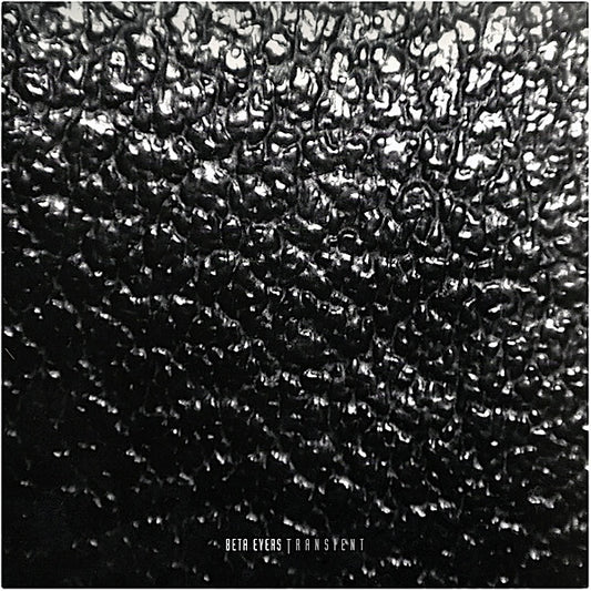 Black and white textured vinyl record cover with "Beta Evers Transient" text.