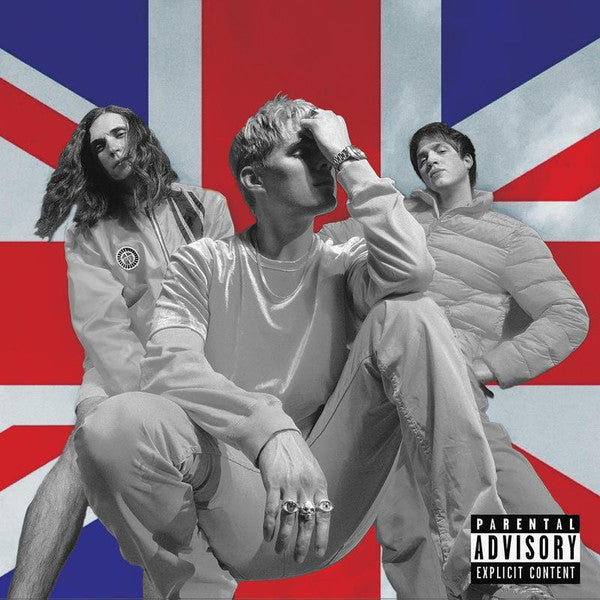 Waterparks band members posing against a blurred Union Jack flag.